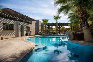 Swimming pool featuring a pergola