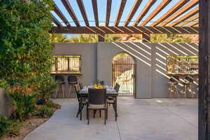 View of patio / terrace with outdoor dining area and a pergola