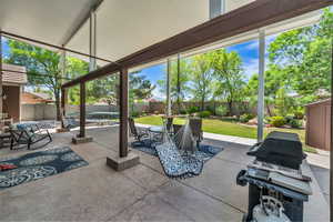 Fenced backyard with grilling area and a patio area