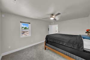 Bedroom featuring carpet and ceiling fan
