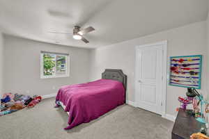 Bedroom featuring carpet flooring and a ceiling fan