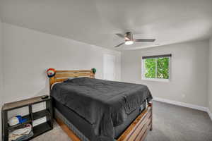 Bedroom featuring carpet flooring and ceiling fan