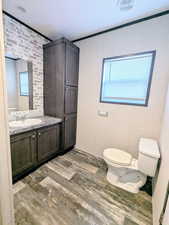 Bathroom with vanity and wood finished floors