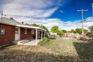 View of yard with a patio