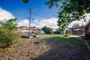 View of yard with a vegetable garden and an outbuilding