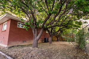 View of side of property featuring brick siding