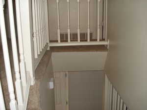 Hallway featuring carpet