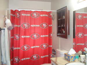 Full bath featuring vanity and a shower with shower curtain