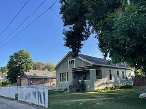 Bungalow with a garage and brick siding