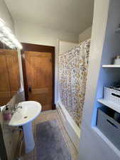 Full bath featuring tile patterned flooring
