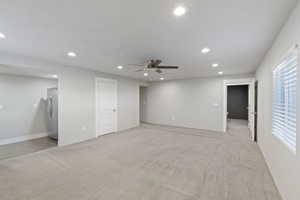 Empty room with recessed lighting, ceiling fan, and light colored carpet