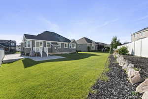 Rear view of property featuring a residential view and a patio