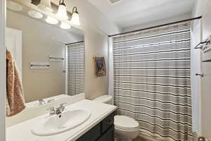 Full bath featuring vanity and a shower with curtain