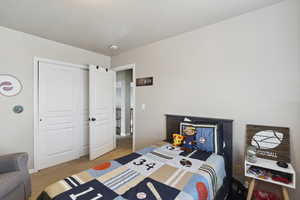 Bedroom with light colored carpet