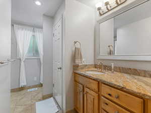 Bathroom featuring vanity, recessed lighting, and tile patterned floors