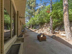 View of patio featuring a fire pit