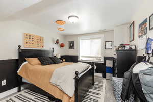 Bedroom featuring light colored carpet
