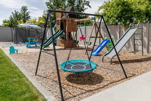 View of playground featuring a fenced backyard