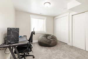 Carpeted office with baseboards
