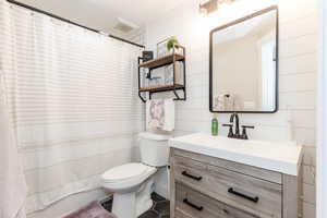 Full bath with vanity, tile patterned flooring, and curtained shower