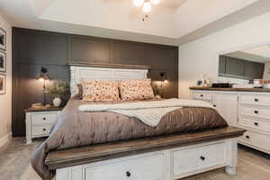 Bedroom featuring a decorative wall
