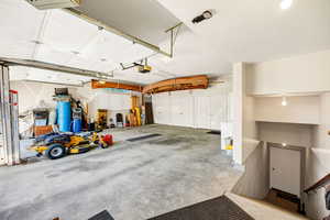 Garage featuring a garage door opener
