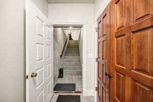 Stairway featuring baseboards