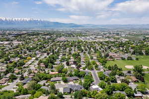 Aerial perspective of suburban area with a mountain backdrop
