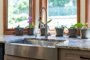 Kitchen view of light stone countertops