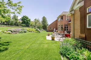 View of yard with a patio area