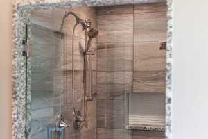 Full bath featuring a shower stall