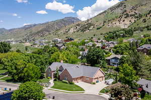 Aerial perspective of suburban area with a mountainous background
