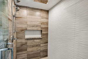 Bathroom with a tile shower