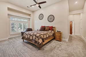 Bedroom featuring light colored carpet, recessed lighting, and ceiling fan