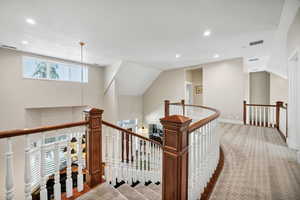 Hall featuring an upstairs landing, recessed lighting, and carpet flooring