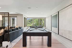 Rec room with pool table, light wood-type flooring, and recessed lighting