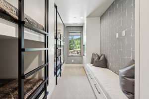 Mudroom featuring light carpet and recessed lighting
