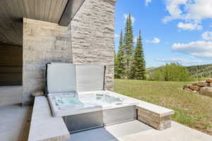 View of patio featuring a hot tub