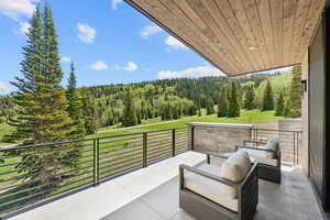 Patio / terrace featuring a forest view