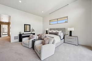 Bedroom featuring light carpet and recessed lighting