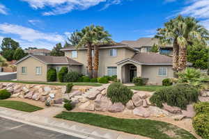 Traditional home with stucco siding and a tile roof