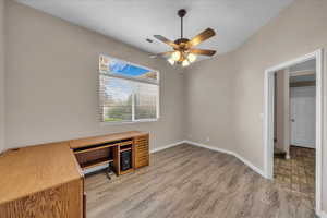 Unfurnished office featuring ceiling fan and light wood-style flooring