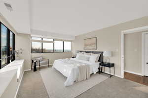 Bedroom with light carpet