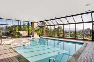 View of swimming pool featuring a pool with connected hot tub (not currently working)