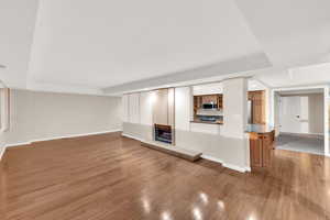 Unfurnished living room with light wood-style flooring and recessed lighting