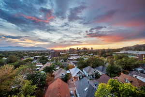 Aerial view at dusk of a mountain view and a city view