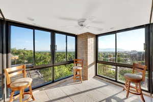 Sunroom / solarium featuring expansive windows