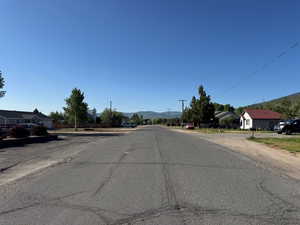 View of asphalt street with a mountain view