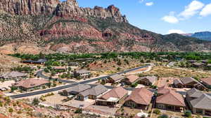 Aerial view of residential area featuring a mountain backdrop