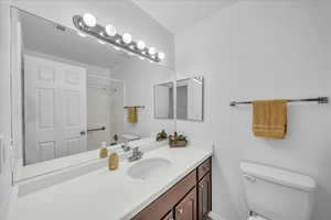 Bathroom with vanity and a shower